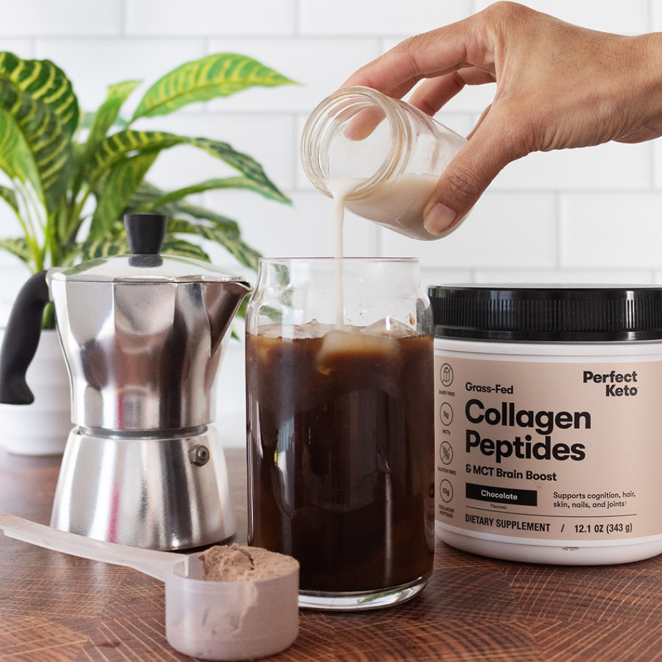 Pouring collagen peptides mixture into clear glass of iced coffee.